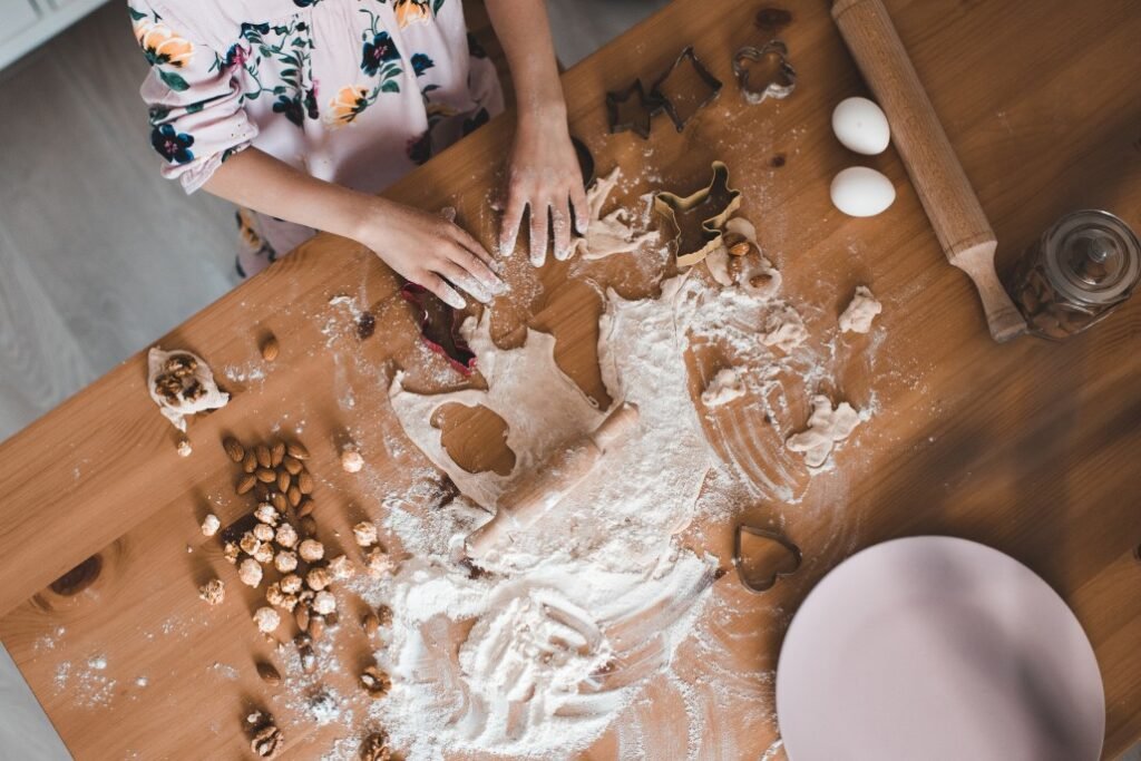 Almond flour spread on wooden kitchen table