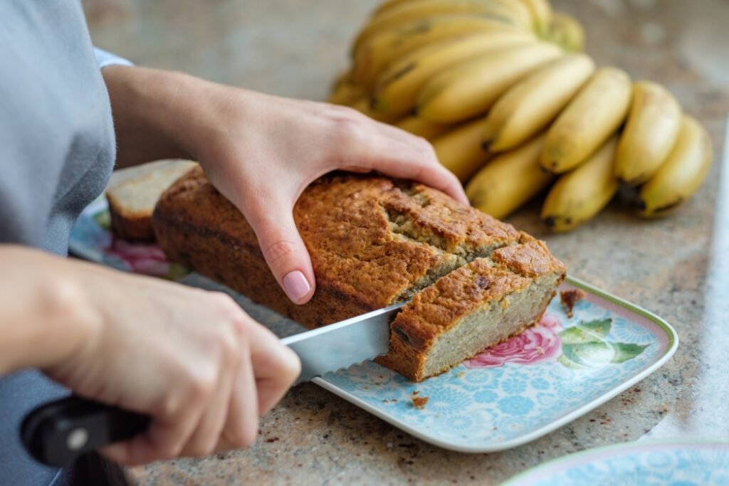Woman slicing banana bread